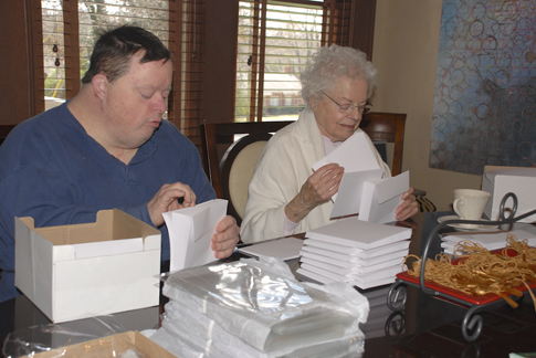 Billy and Jane count envelopes for the notecards decorated with Tom's labyrinth studies. Billy and Jane count envelopes for the notecards decorated with Tom's labyrinth studies.