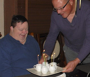 Tom brings Billy's birthday desserts to the table. Happy Birthday... again! Tom brings Billy's birthday desserts to the table. Happy Birthday... again!
